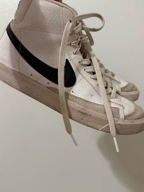 Nike Mid-Top Sneakers in White with Black Swoosh